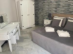 Postel nebo postele na pokoji v ubytování Villa Kathleen