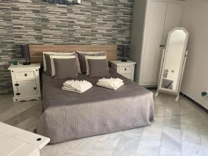 Postel nebo postele na pokoji v ubytování Villa Kathleen