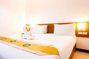 Postel nebo postele na pokoji v ubytování Neptuna Hotel