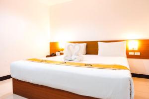 Postel nebo postele na pokoji v ubytování Neptuna Hotel