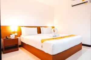 Postel nebo postele na pokoji v ubytování Neptuna Hotel