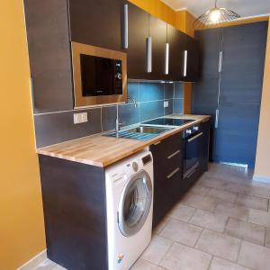 Kuchyňa alebo kuchynka v ubytovaní Le vent dans les voiles - Appartement classé 4 étoiles