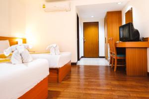 Postel nebo postele na pokoji v ubytování Neptuna Hotel