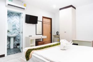 Postel nebo postele na pokoji v ubytování Neptuna Hotel