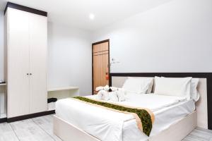 Postel nebo postele na pokoji v ubytování Neptuna Hotel