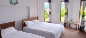 Postel nebo postele na pokoji v ubytování Elegant Holiday Home