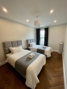 Ein Bett oder Betten in einem Zimmer der Unterkunft Portobello Living