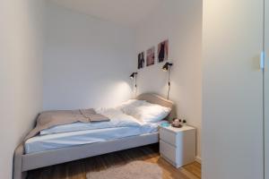Posteľ alebo postele v izbe v ubytovaní Central Apartment