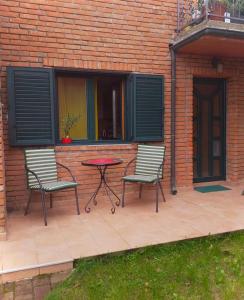 two chairs and a table on a patio at Taras House in Zvezdara