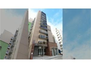 wysoki budynek w mieście z budynkami w obiekcie ＹＯＵ ＳＴＹＬＥ ＨＯＴＥＬ ＨＡＫＡＴＡ - Vacation STAY 16033v w mieście Fukuoka