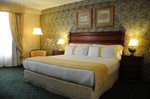a bedroom with a large bed in a hotel room at InterTower Hotel in Santa Fe +36 photos