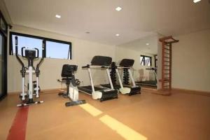 a gym with several treadmills and machines in a room at Flat Bienal Ibirapuera UH507 in Sao Paulo