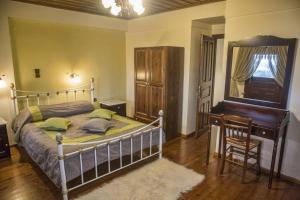 Letto o letti in una camera di T'Asprolithia
