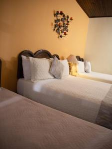 Кровать или кровати в номере Hotel Plaza Copan