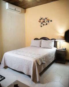 Кровать или кровати в номере Hotel Plaza Copan