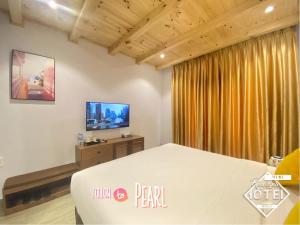 TV a/nebo společenská místnost v ubytování Riverside Mini Hotel Grand World Phu Quoc