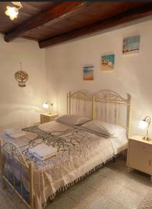 Giường trong phòng chung tại A casa di Nonna IUN Q2951