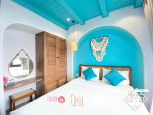 Postel nebo postele na pokoji v ubytování Riverside Mini Hotel Grand World Phu Quoc