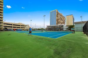 two people playing tennis on a tennis court at Sea Watcher in Ocean City