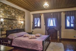 Postel nebo postele na pokoji v ubytování T'Asprolithia