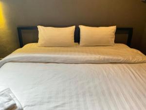 Postel nebo postele na pokoji v ubytování Capsule Hostel Chiangkhan