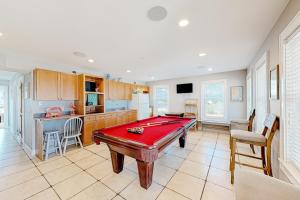 a kitchen with a pool table in a room at San Flamingo 486 in Rodanthe