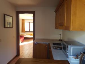 a kitchen with a sink and a counter top at Da Petro Appartamenti per vacanze in Pila