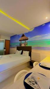 En eller flere senge i et værelse på Motel Premium (Adults Only)