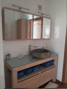 a bathroom with a sink and a counter top at Logement dans le cœur historique de Mons in Mons