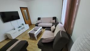 a living room with a couch and a tv at Apartment - Sunny Peaks in Pale