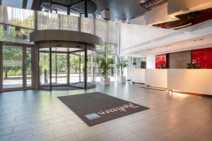 an office lobby with a rug on the floor at Radisson Blu Elizabete Hotel, Riga in Rīga