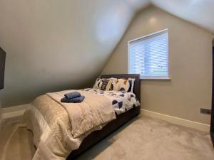a bedroom with a bed and a window at Executive Boutique Holiday Home - CS in Southport