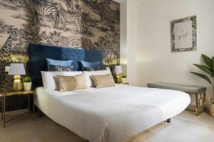 Posteľ alebo postele v izbe v ubytovaní Unika Homes Málaga Beach & City