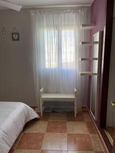 Ένα ή περισσότερα κρεβάτια σε δωμάτιο στο SlowHome Rota +4 φωτογραφίες