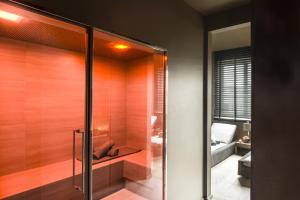 a bathroom with a toilet and a shower stall at Rosa Grand Milano - Starhotels Collezione in Milan