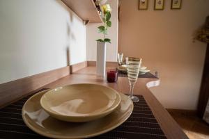 a table with plates and wine glasses on it at Sun Garden in Čitluk +42 photos