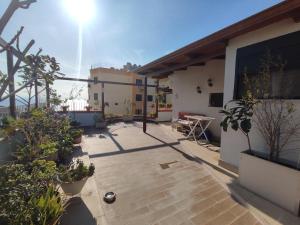 a balcony of a house with a patio at Promenade 3-Bedroom apartment with large balcony. in Durrës