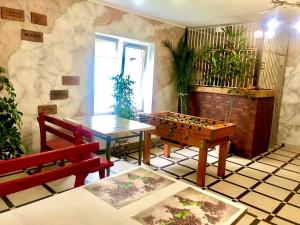 a living room with a table and a chess board at Good House Yaremche in Yaremche