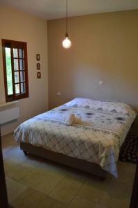a bedroom with a bed in the corner of a room at Villa Consta in Tsagarada