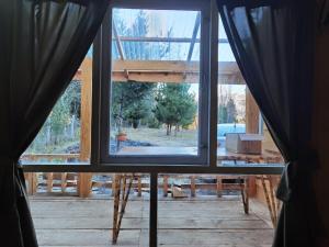 a view from a window of a house under construction at Cabaña May Pao, para 3 en Melipeuco cerca del Parque Nacional Conguillio in Melipeuco