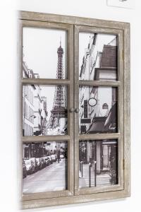 een raam met uitzicht op de eiffeltoren bij Le 18-GregIMMO-Appart'Hôtel in Bavilliers