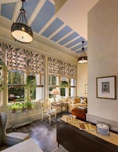 a living room with a couch and a table at Wentworth Mansion in Charleston