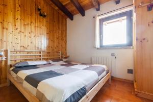 Posteľ alebo postele v izbe v ubytovaní Panorama 1200, in the Heart of the San Fermo Hills
