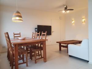 a dining room with a wooden table and chairs at Apartment Frankfurt City View - Oberursel in Oberursel