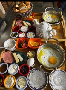 a tray of food with eggs and other ingredients at Maajid Hotel & Restaurant in Baku