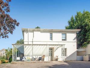 a white house with a white curtain in front of it at Glenthorne Villa Torquay in Torquay