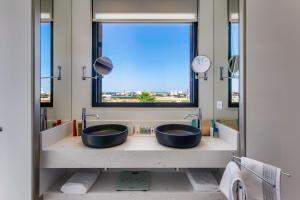 A bathroom at Villa Mariba Blue by Villa Plus