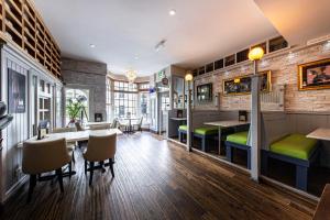 a bar with a table and chairs in a room at Snooze in Llandudno