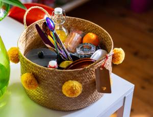 a basket filled with items on a table at Number 18 in Conwy