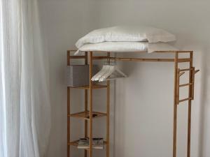 a bunk bed with a pillow on top of it at Tecnopolo Fiera Suite in Bologna